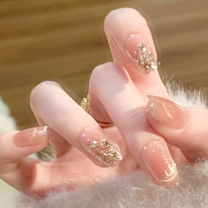 Artificial nail set with sparkling glitter and 3D applications Bowlift