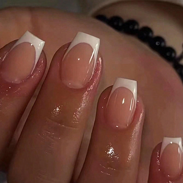 Artificial nails in elegant French style Bowlift