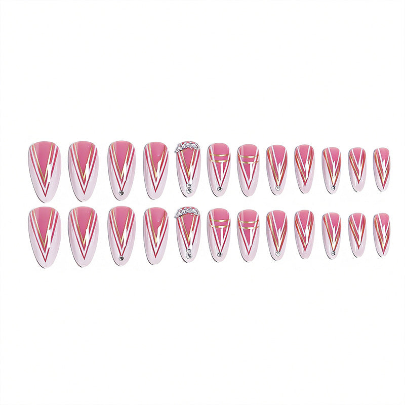 Acrylic nail set with elegant stiletto shape and luxurious embellishments Bowlift