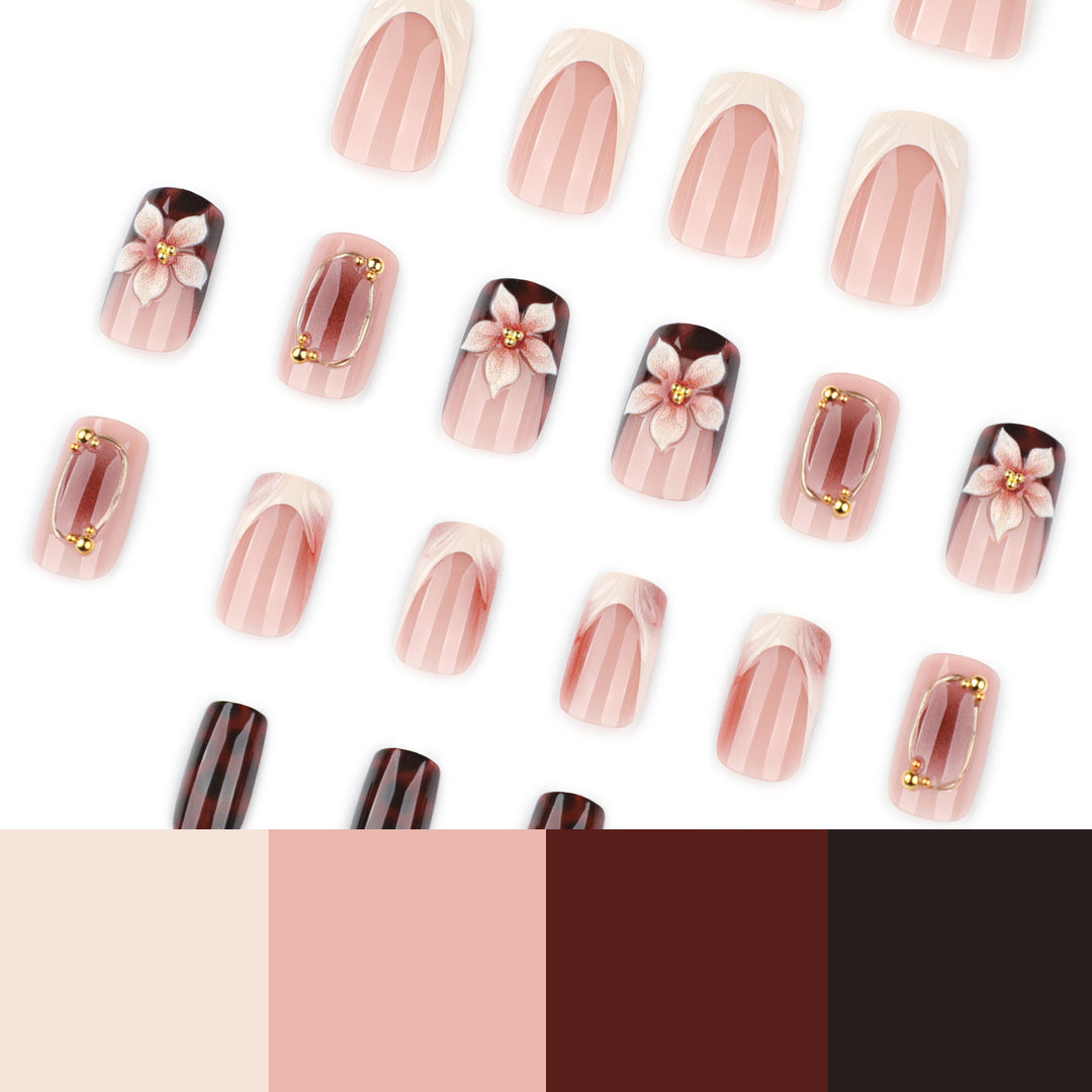 Artistic stiletto nails with elegant floral design and glitter effects Bowlift
