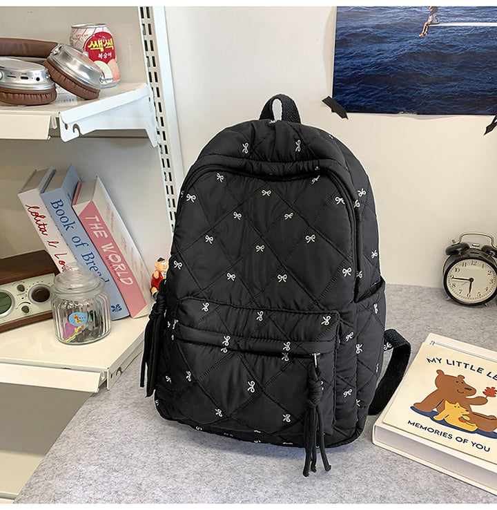 Quilted Backpack with Decorative Tassels