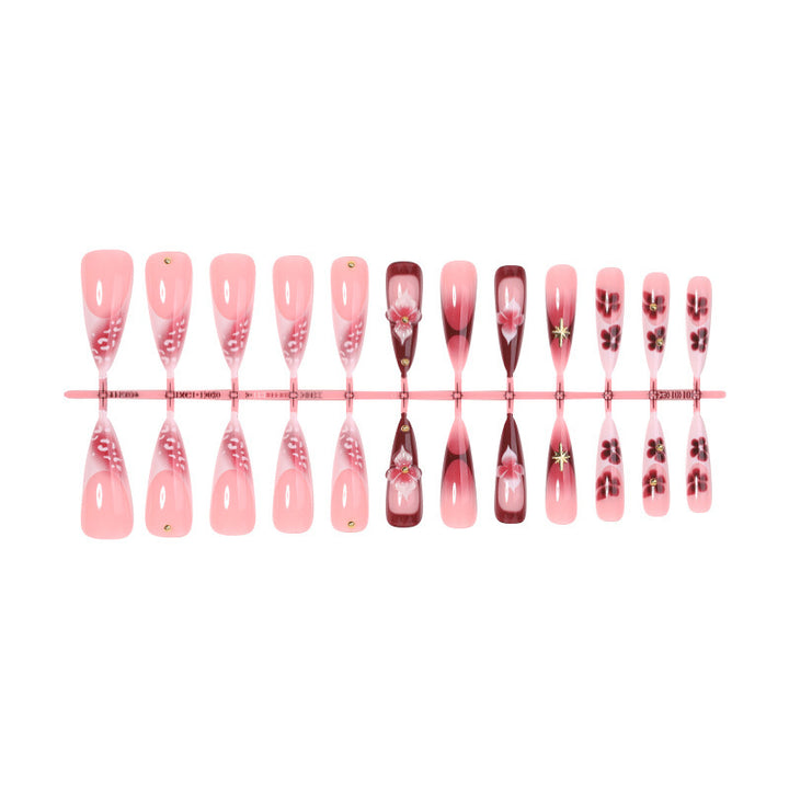 Artifical nail set with delicate floral design and glamorous accents Bowlift