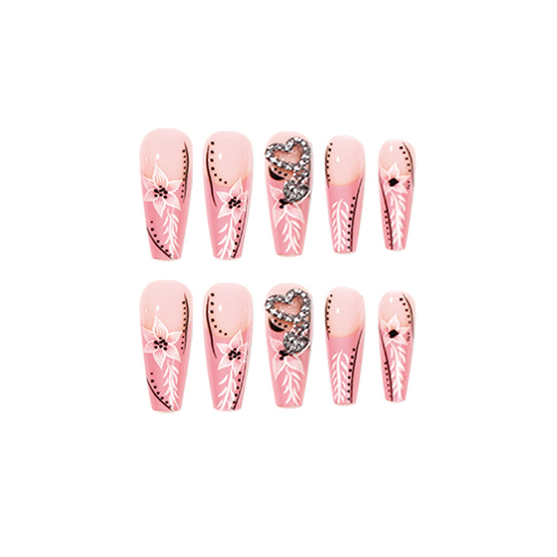 Artistic nail art with flower and heart motifs Bowlift