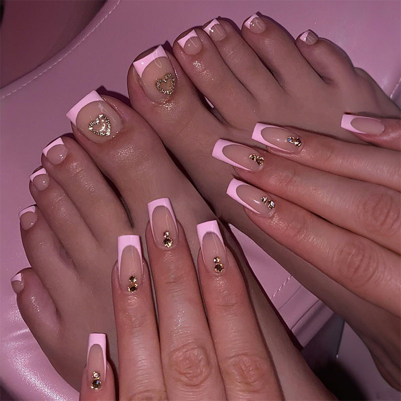 Artificial nail set with elegant French tip design and modern accents Bowlift