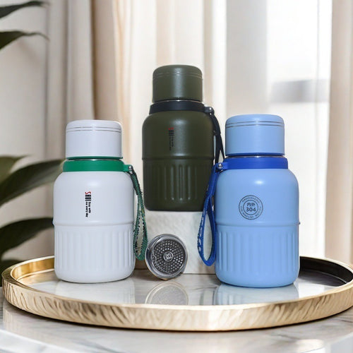 Insulated drinking bottle with integrated carrying strap Bowlift