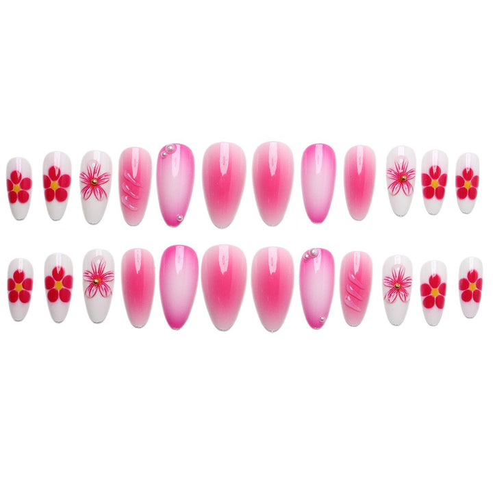 Artificial nail set with delicate flower designs and shimmering accents Bowlift