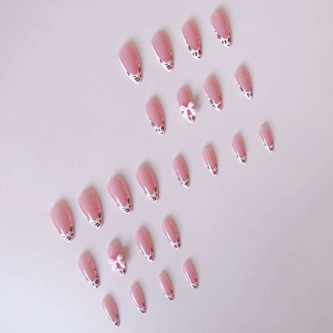 Acrylic nail set with leopard pattern and decorative bows Bowlift