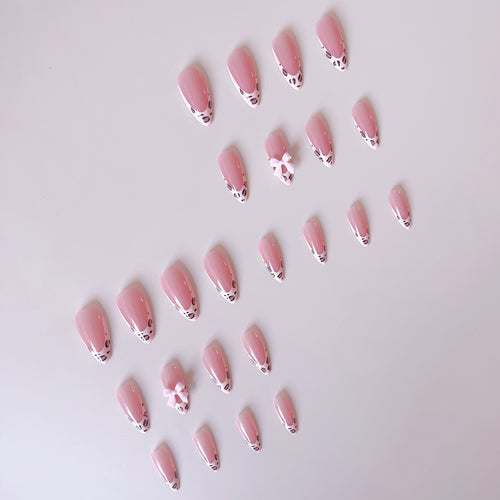 Acrylic nail set with leopard pattern and decorative bows Bowlift