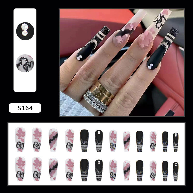 Artificial nail set with creative 3D elements and sparkling accents Bowlift