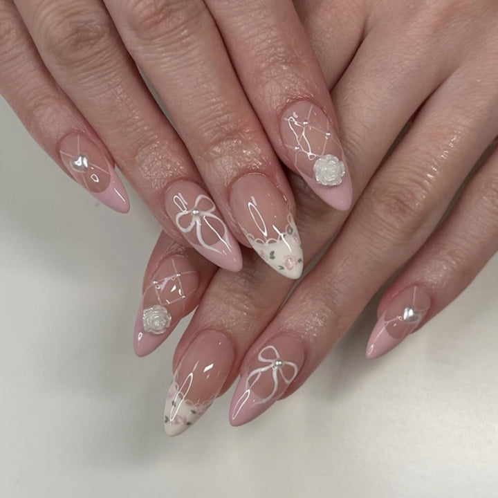 Artful nail art with floral details and bow embellishments Bowlift