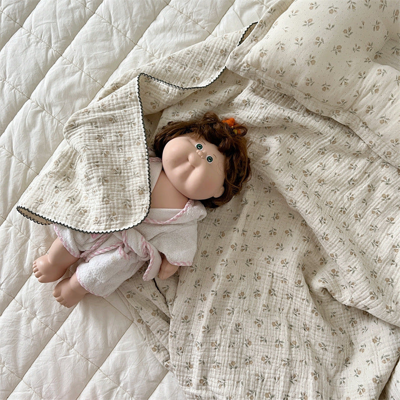 Unisex Muslin Blanket with delicate floral design and elegant ruffles Bowlift