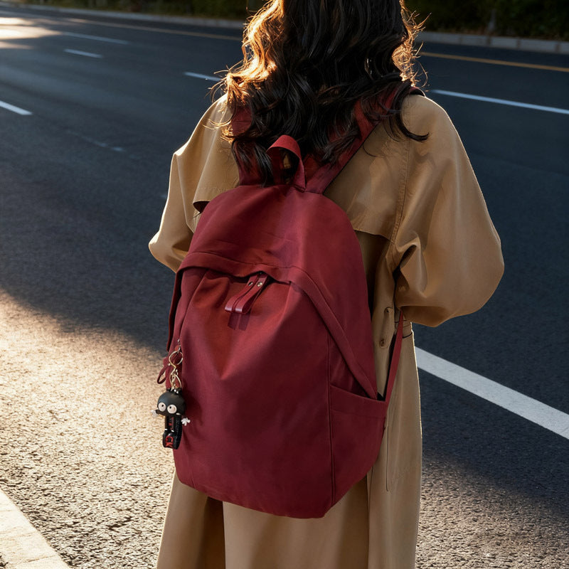 Fashionable backpack with practical design and decorative pendant Bowlift