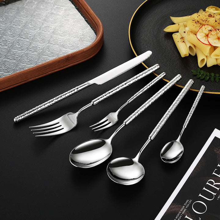Elegant dessert spoon with elaborate handle design Bowlift
