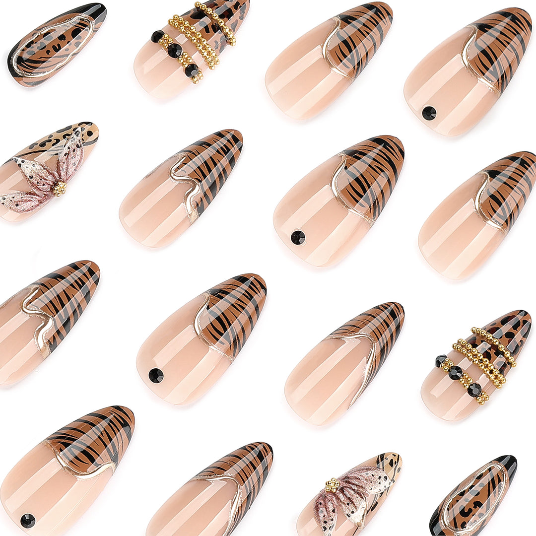 Artful stiletto nail with floral accents and gold embellishments Bowlift