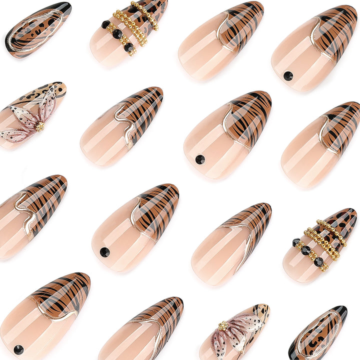 Artful stiletto nail with floral accents and gold embellishments Bowlift