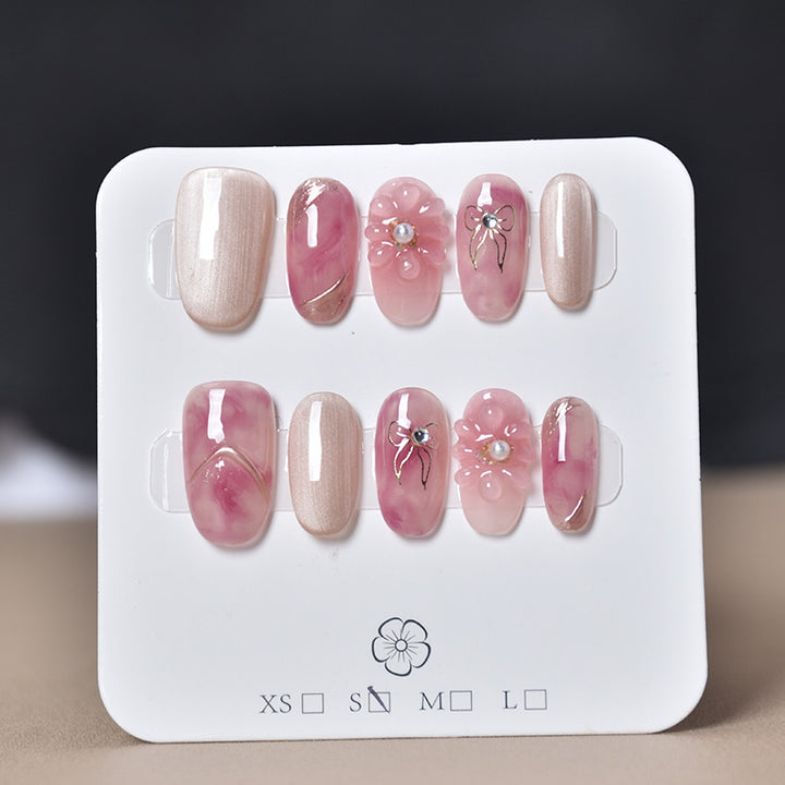 Elegant Nail Art Extensions with Pearl Accents Bowlift