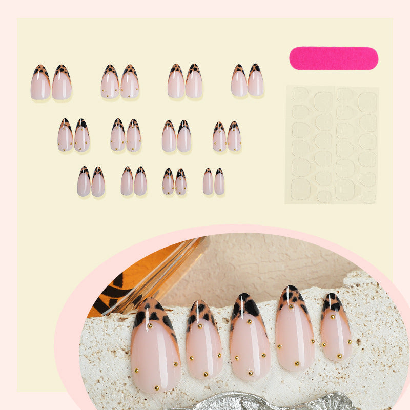 Artificial nail set with elegant leopard pattern and golden accents Bowlift