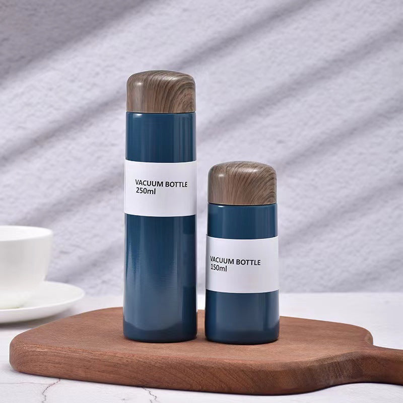 Women vacuum-insulated water bottle with innovative wooden lid Bowlift