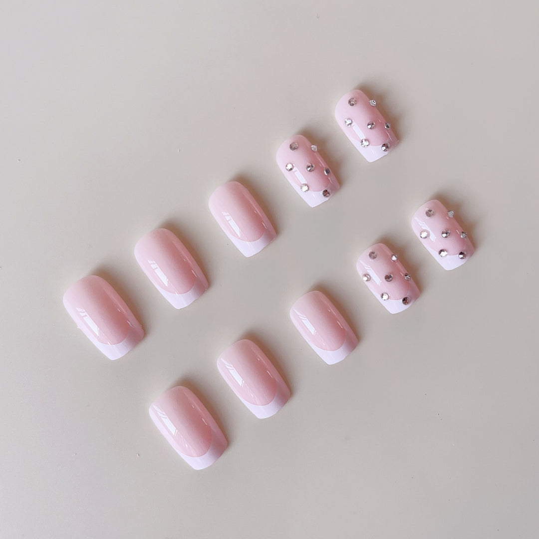 Artificial nail set with elegant rhinestones and French tip decorations Bowlift