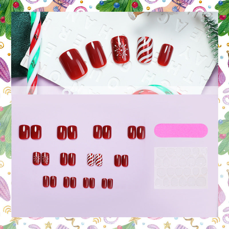Artificial nail set with festive designs and glitter accents Bowlift