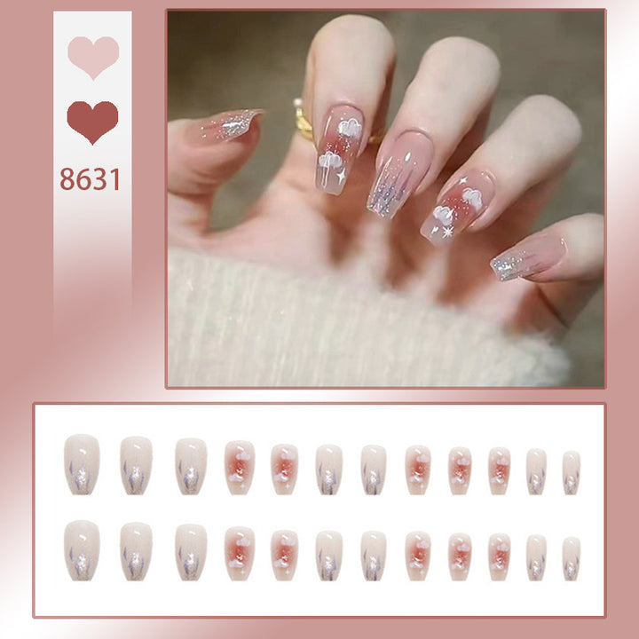 Artificial nail set with floral design and glitter accents Bowlift