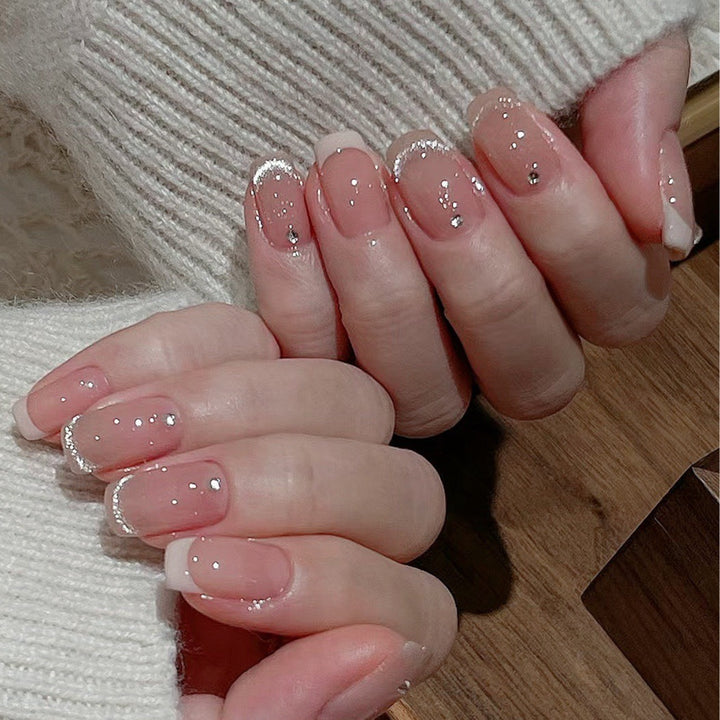 Glamorous artificial nails with filigree rhinestone details Bowlift