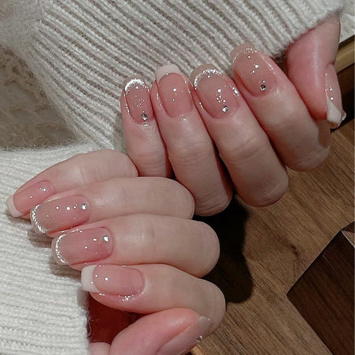 Glamorous artificial nails with filigree rhinestone details Bowlift