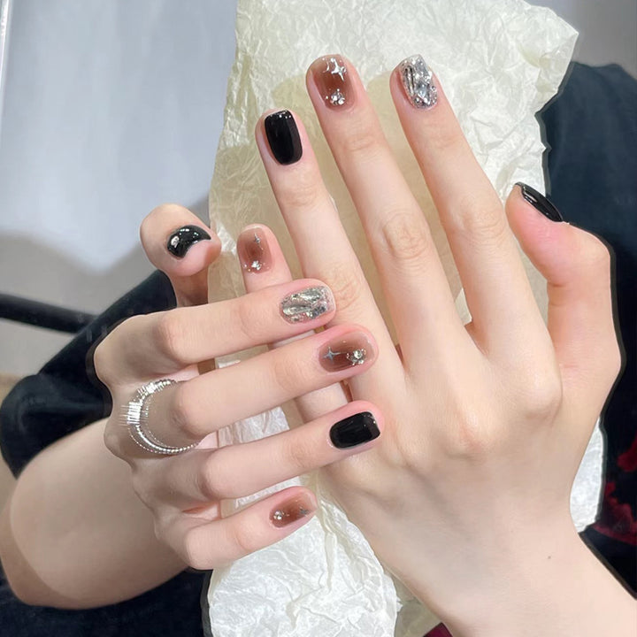 Artistic Press-On Nail Set with Glittery Star Accents Bowlift