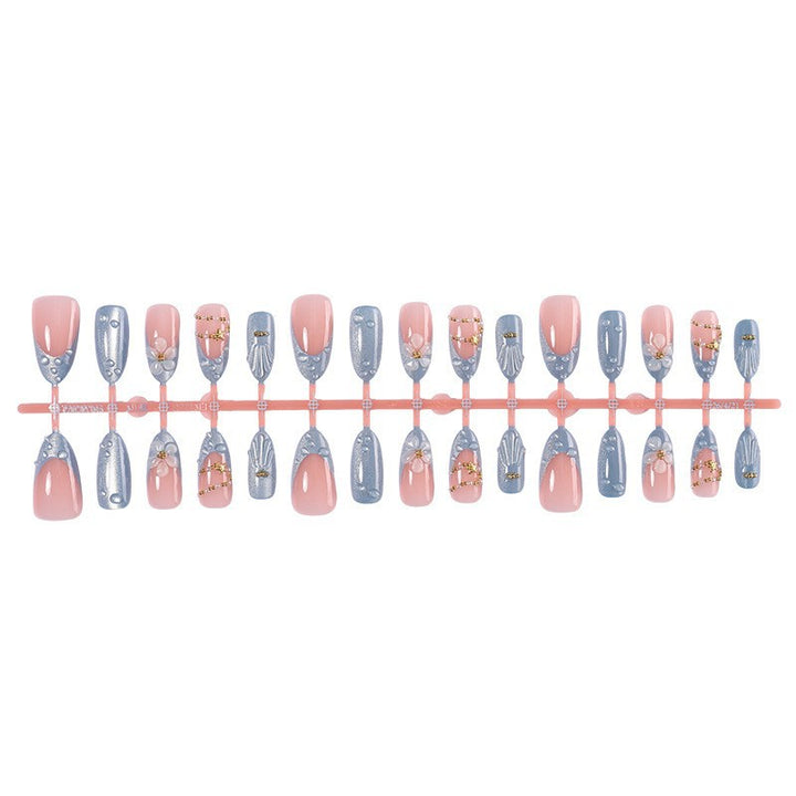 Creative acrylic nail set with elegant flower and glitter accents Bowlift