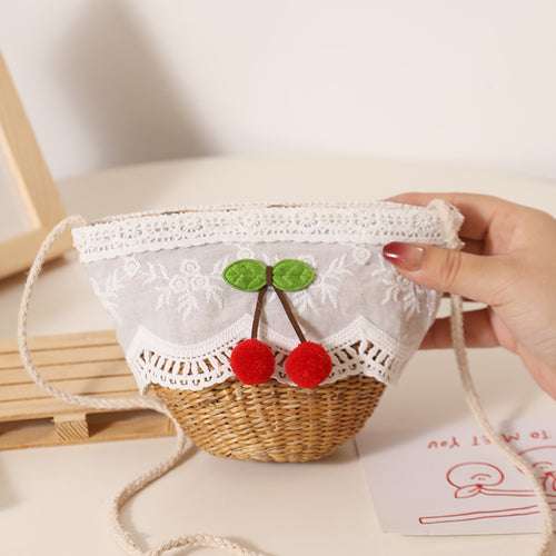Playful straw shoulder bag with floral accents Bowlift