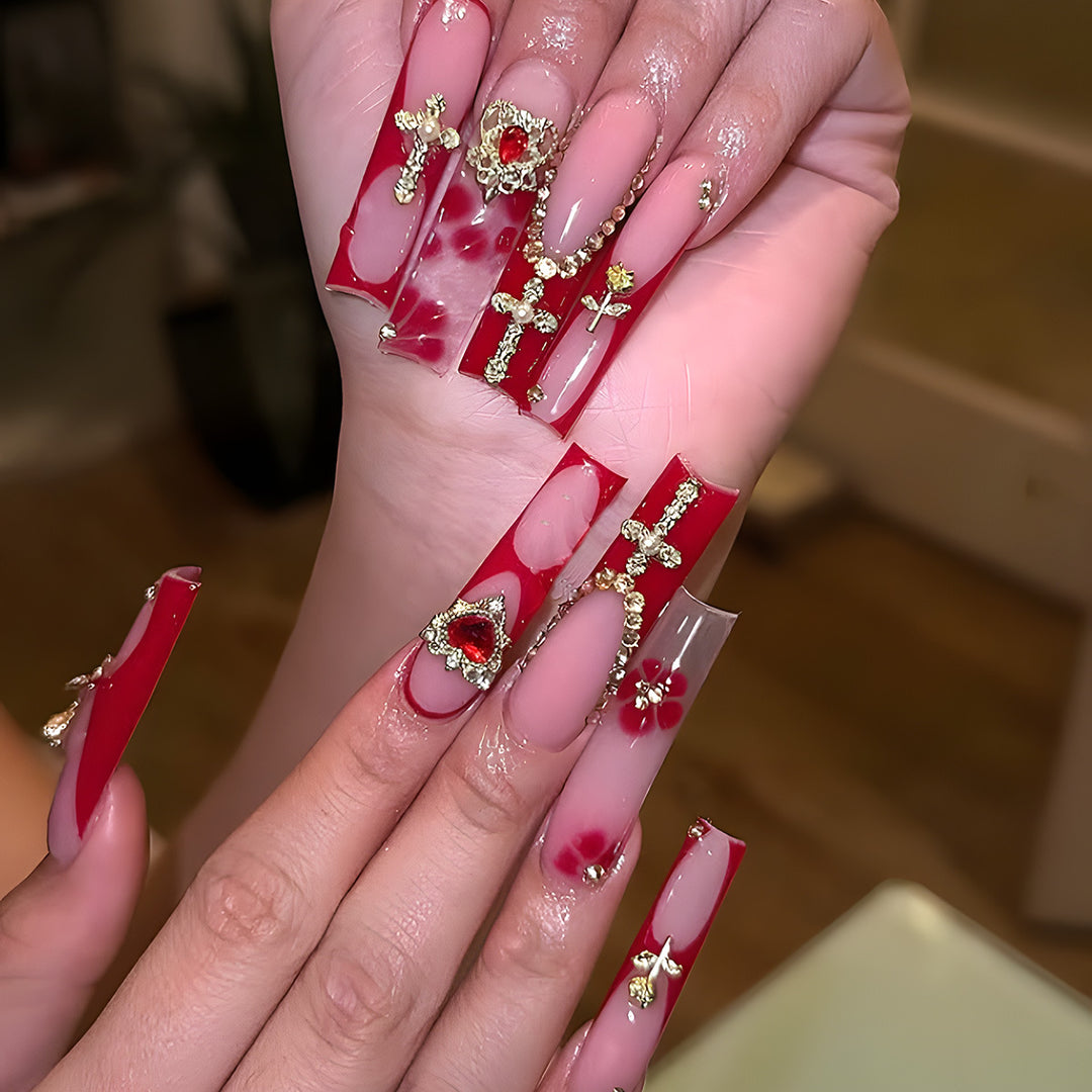 Glamorous Stiletto Press-On Nails with Artistic Gold and Red Accents Bowlift