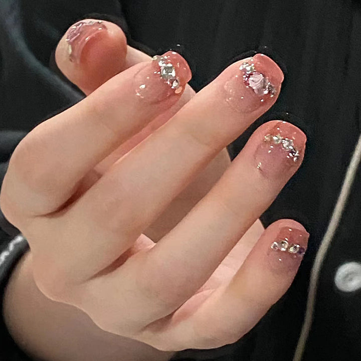 Glamorous nail art with rhinestone details Bowlift