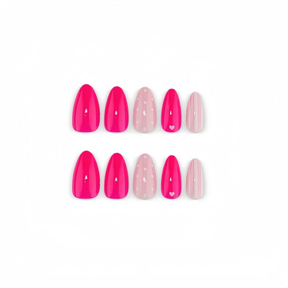 Artificial nails in playful design with hearts and dots Bowlift