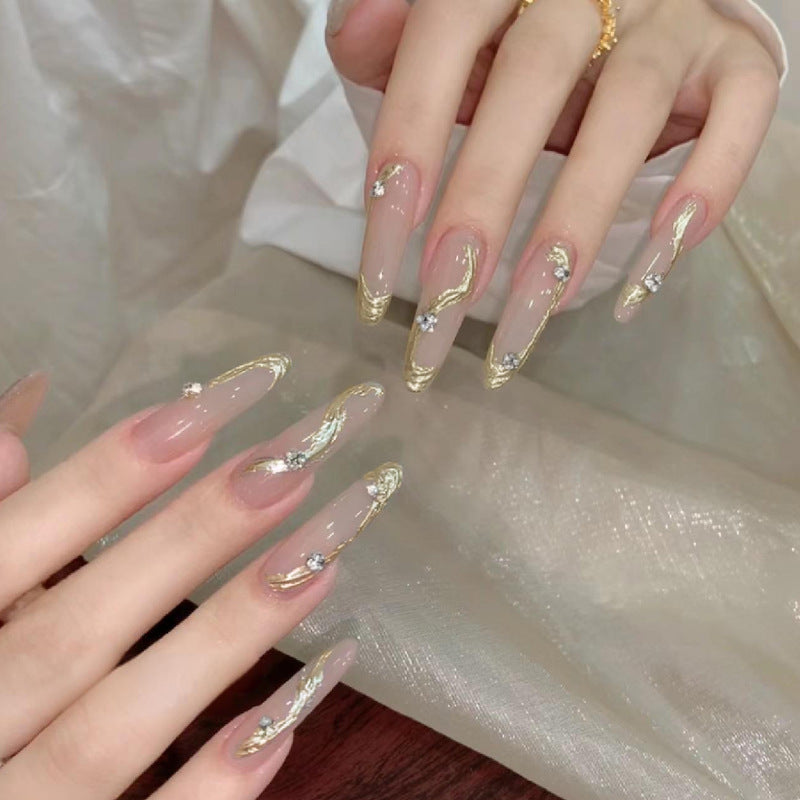 Artificial nail set with elegant gold design and sparkling applications Bowlift