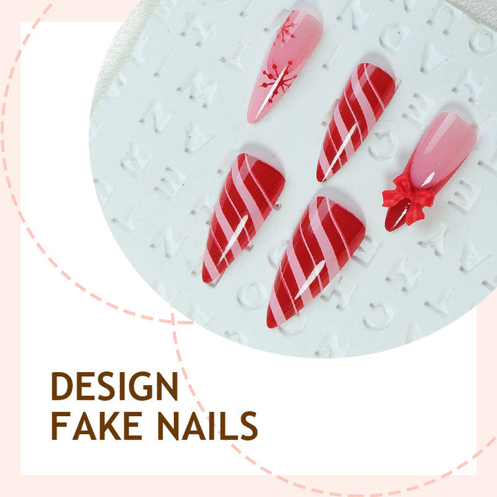 Creative nail art set with festive motifs and embellished accents Bowlift