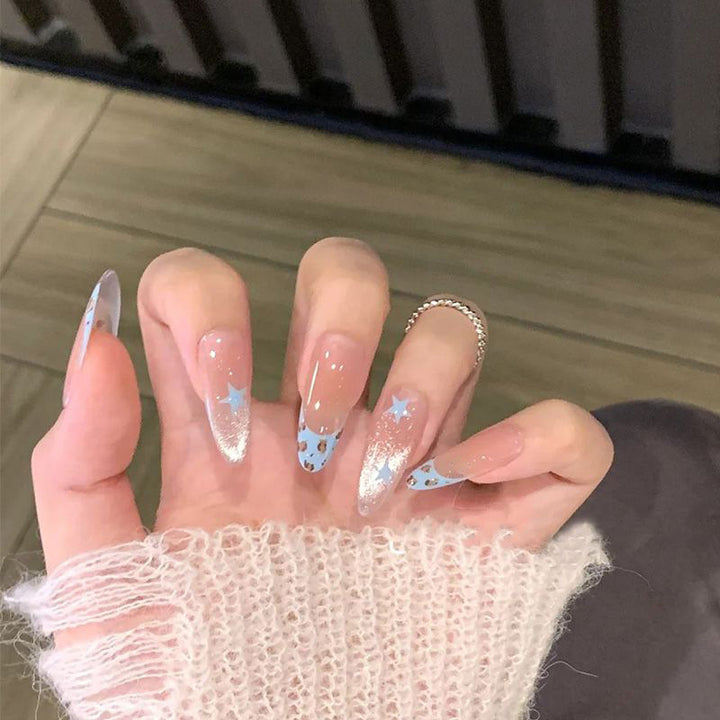 Artistic Press-On Nail Design with Floral and Glitter Accents Bowlift