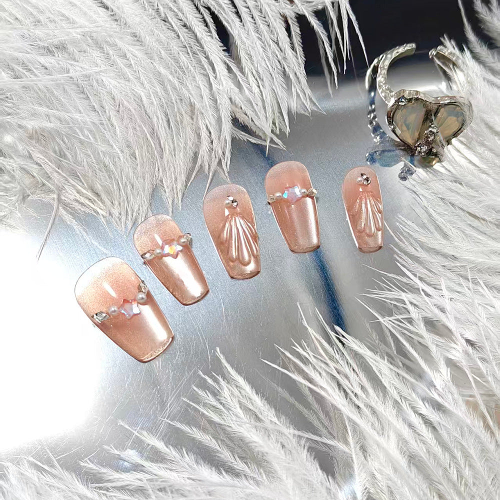 Exquisite artificial nails with glitter and pearl accents Bowlift