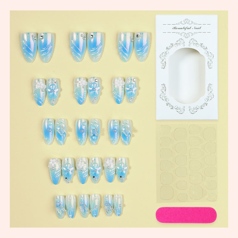 Creative nail set with floral accents and glittering details Bowlift