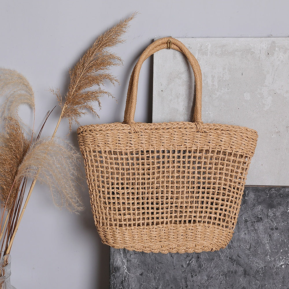 Basket bag made of natural raffia with sturdy carrying handles Bowlift