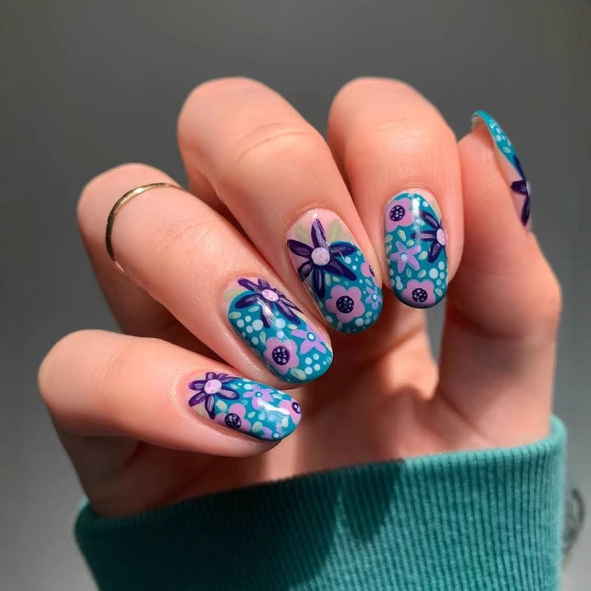Nail art set with floral accents and vibrant patterns Bowlift