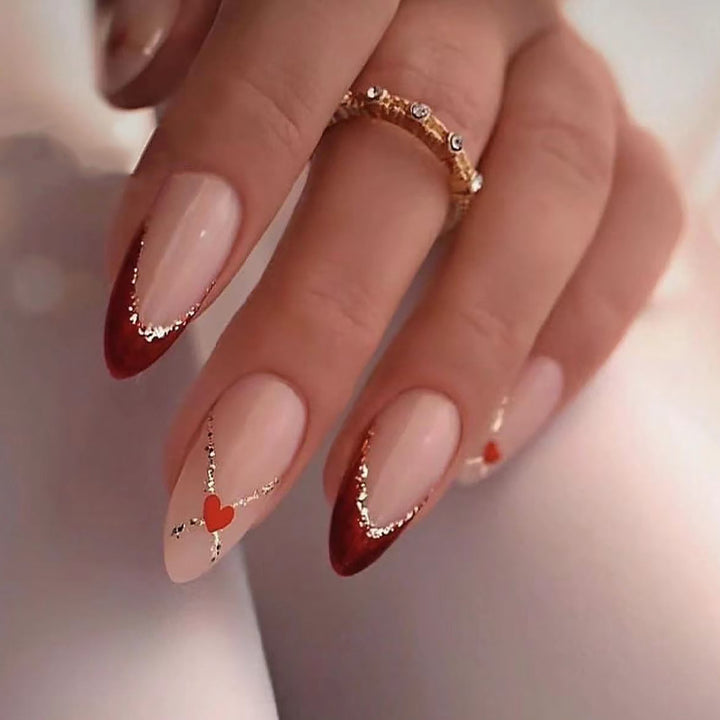 Acrylic nails with heart motifs and glitter details Bowlift