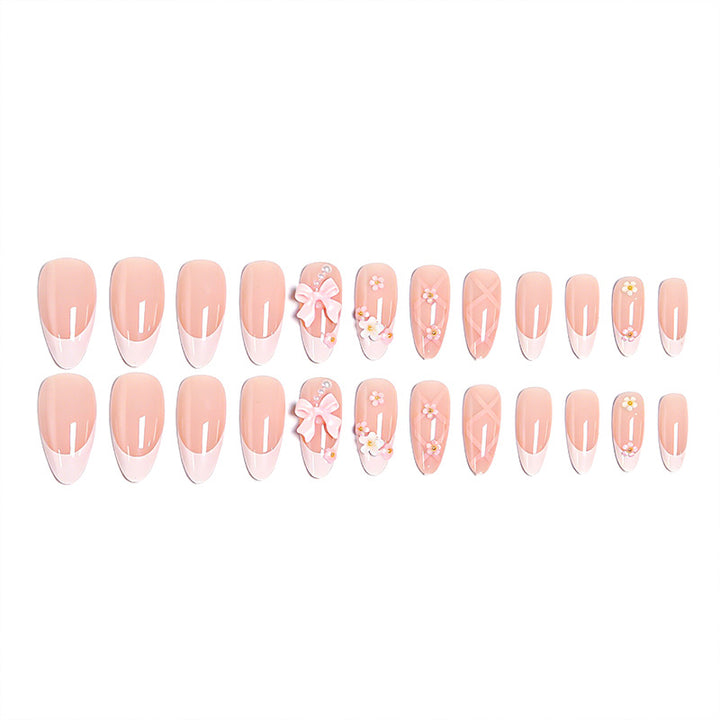 Artful Nail Tips with Ribbons and Floral Decorations Bowlift