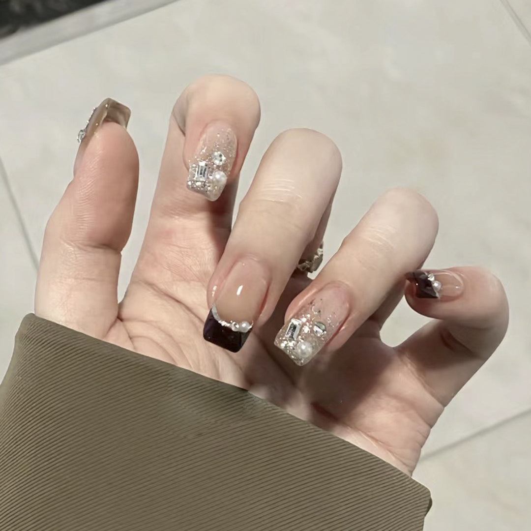 Artistic nail designs with glitter and rhinestone accents Bowlift