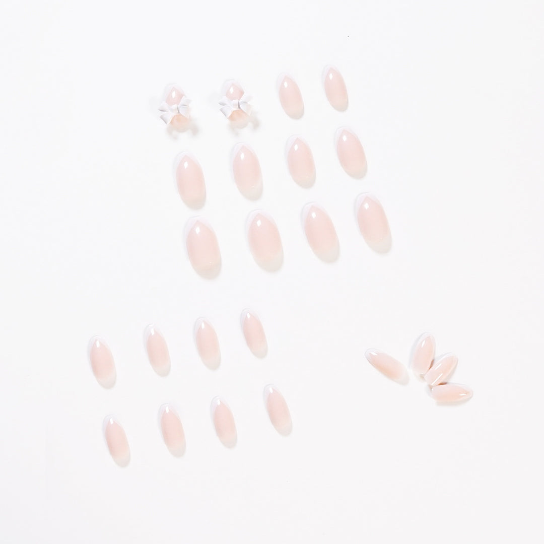 Elegant artificial nails with translucent French tip and decorative floral accents Bowlift