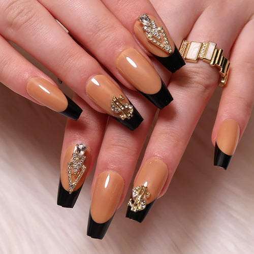 Glamorous artificial nails with rhinestones and black tips Bowlift