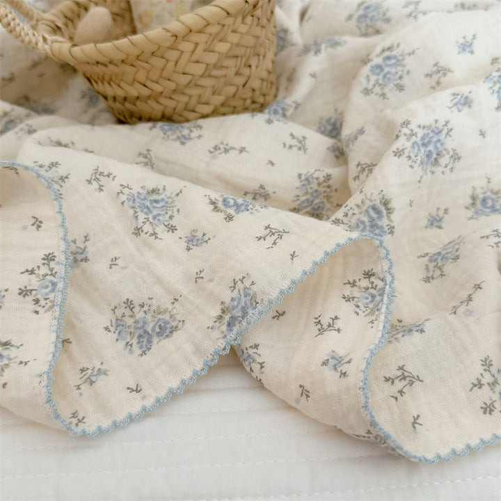 Unisex Muslin Blanket with delicate floral design and elegant ruffles Bowlift