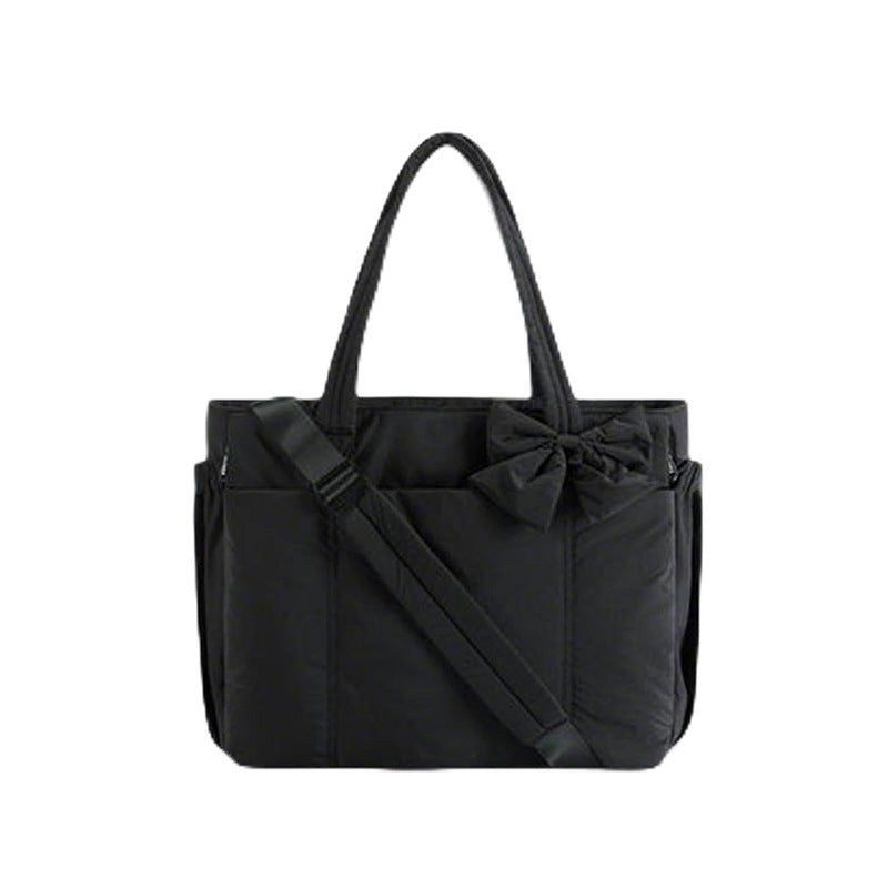 Practical tote bag with retractable shoulder strap and fashionable bow Bowlift