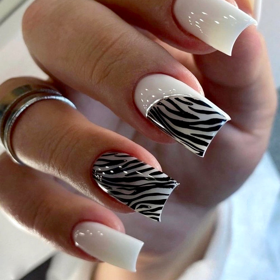 Artful nail extensions with stylish zebra pattern Bowlift