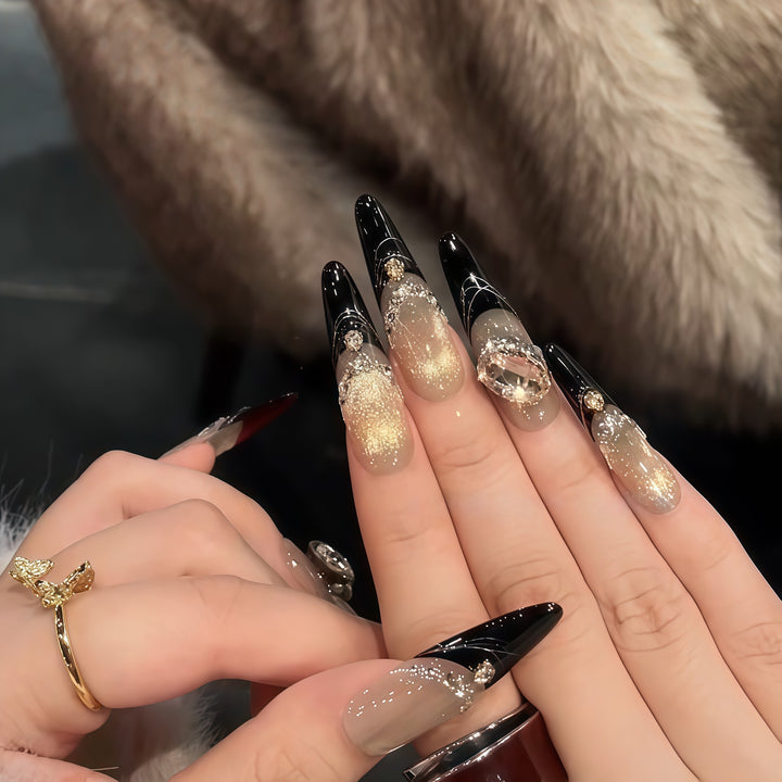 Glamorous artificial nails with extravagant rhinestone and glitter insets Bowlift