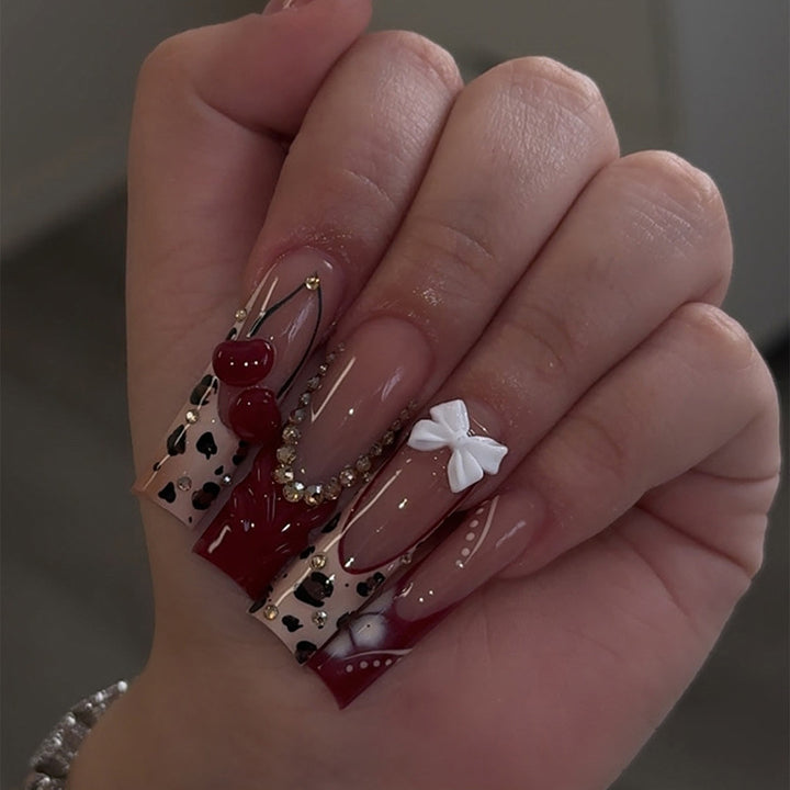 Artistic Press-On Nail Set with Decorative Accents Bowlift